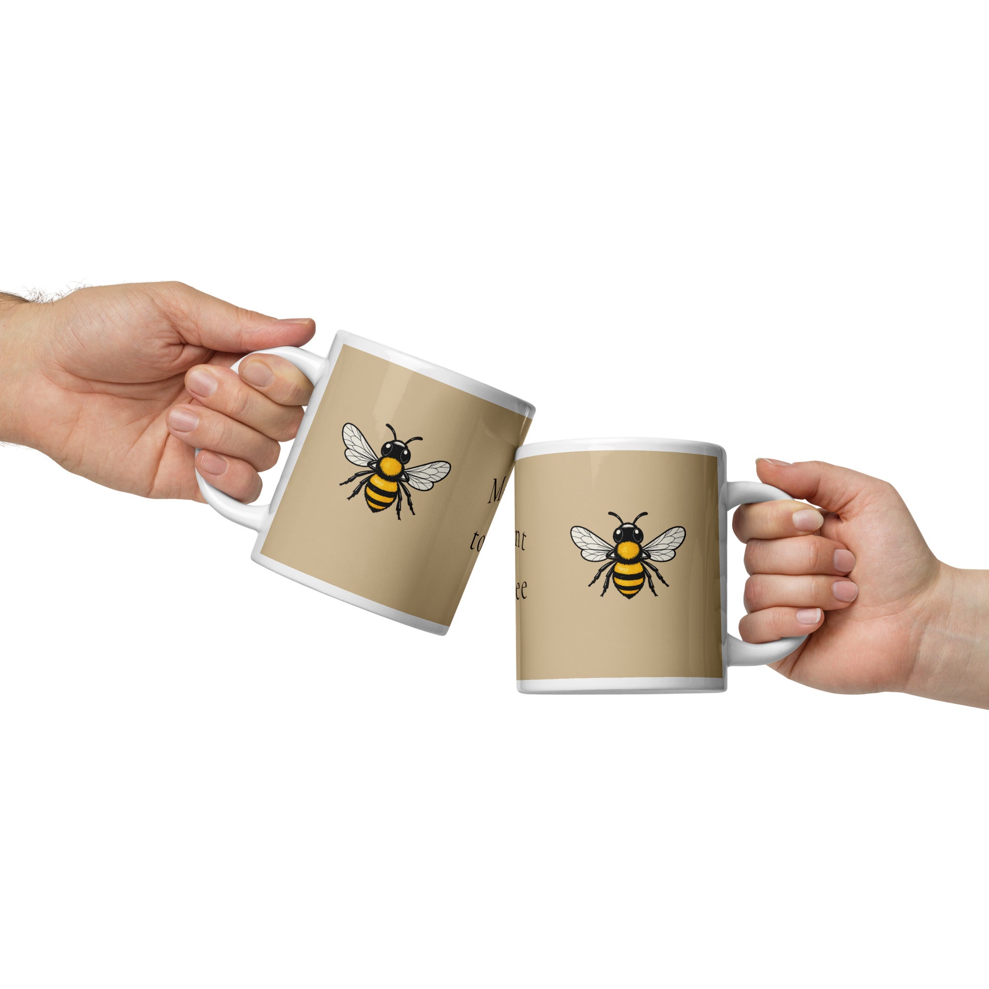 Two hands holding beige ceramic mugs with white handles, each showing yellow-and-black bee