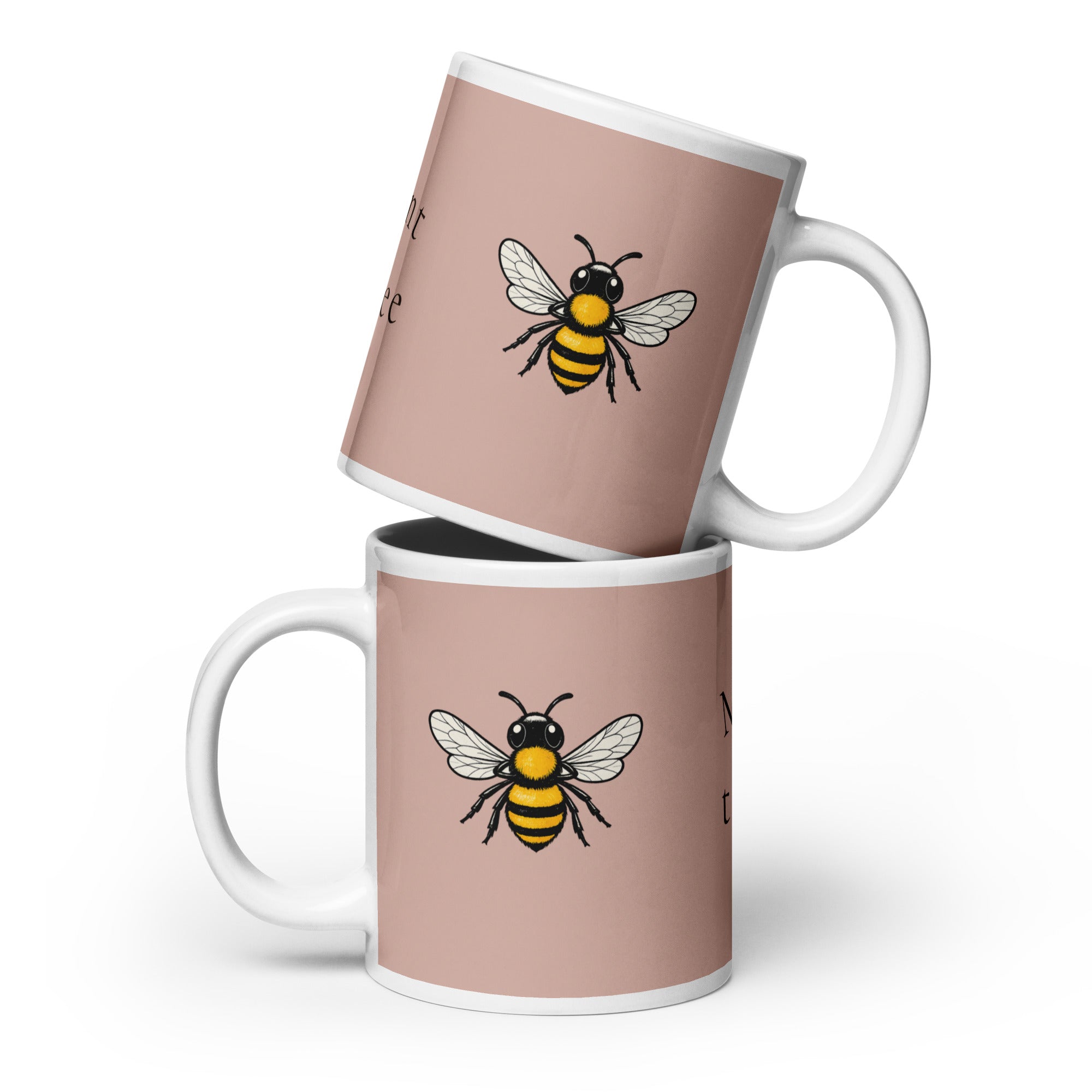 Stacked dusty rose ceramic mugs with bee illustration and white handles