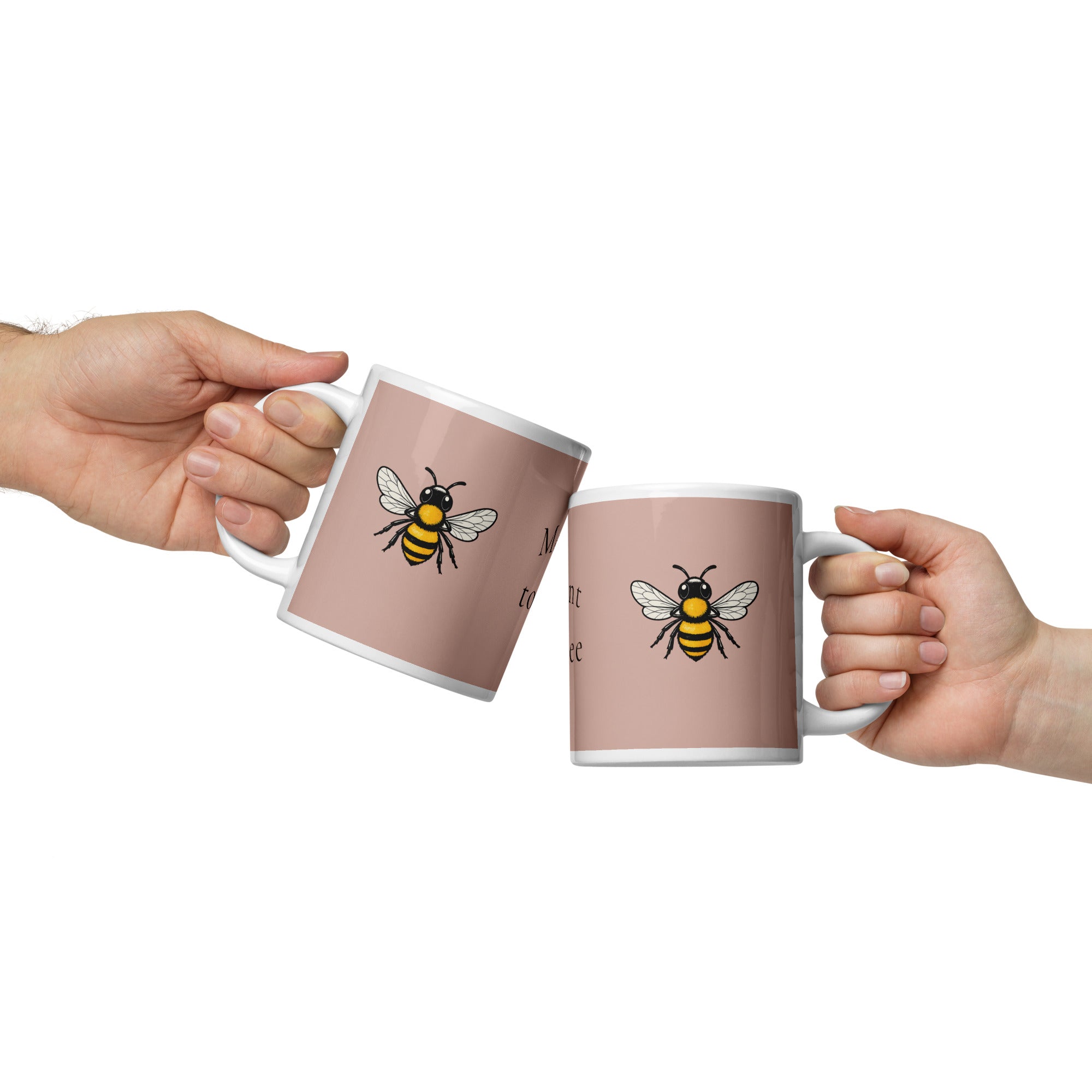 Pair of dusty rose ceramic coffee mugs with bee illustrations, white rims