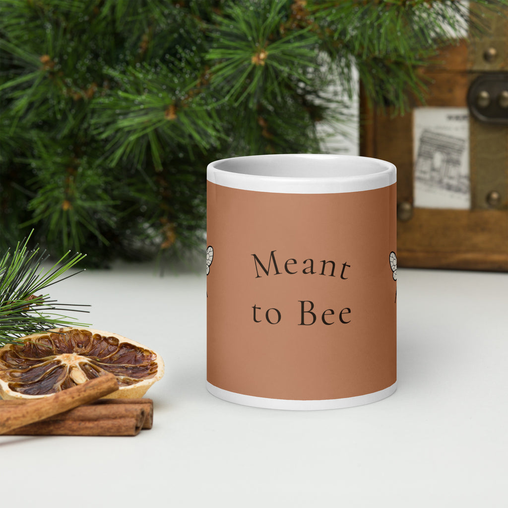 Brown ceramic mug with "Meant to Bee" print, white rim and handle