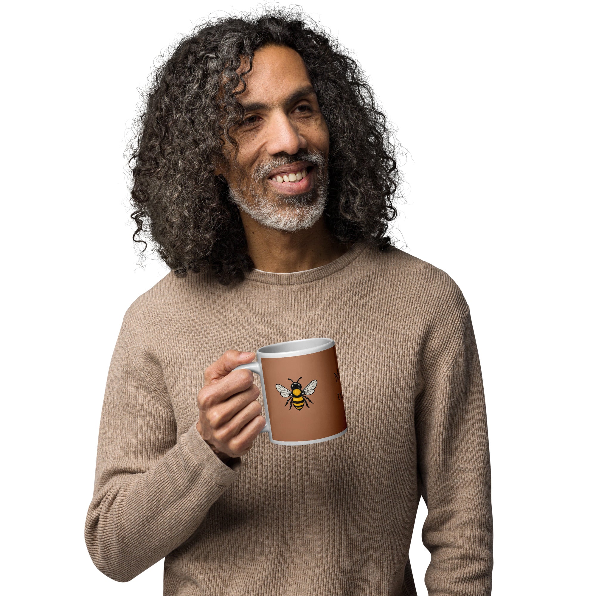 Brown ceramic coffee mug with bee illustration, held in hand