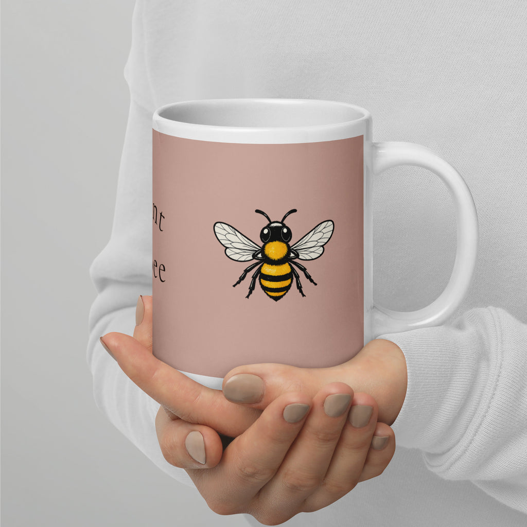 Dusty rose ceramic mug with bee graphic, white interior and right-side handle