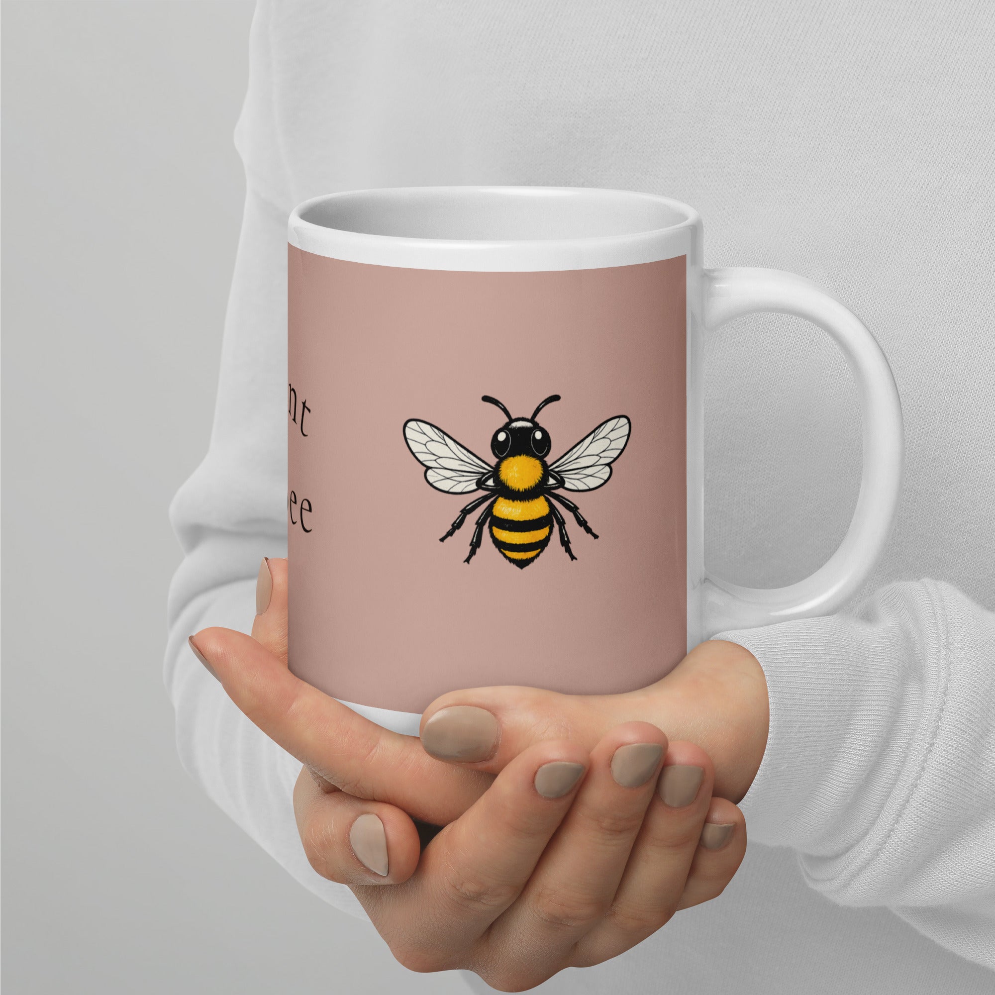 Dusty rose ceramic mug with bee graphic, white interior and right-side handle