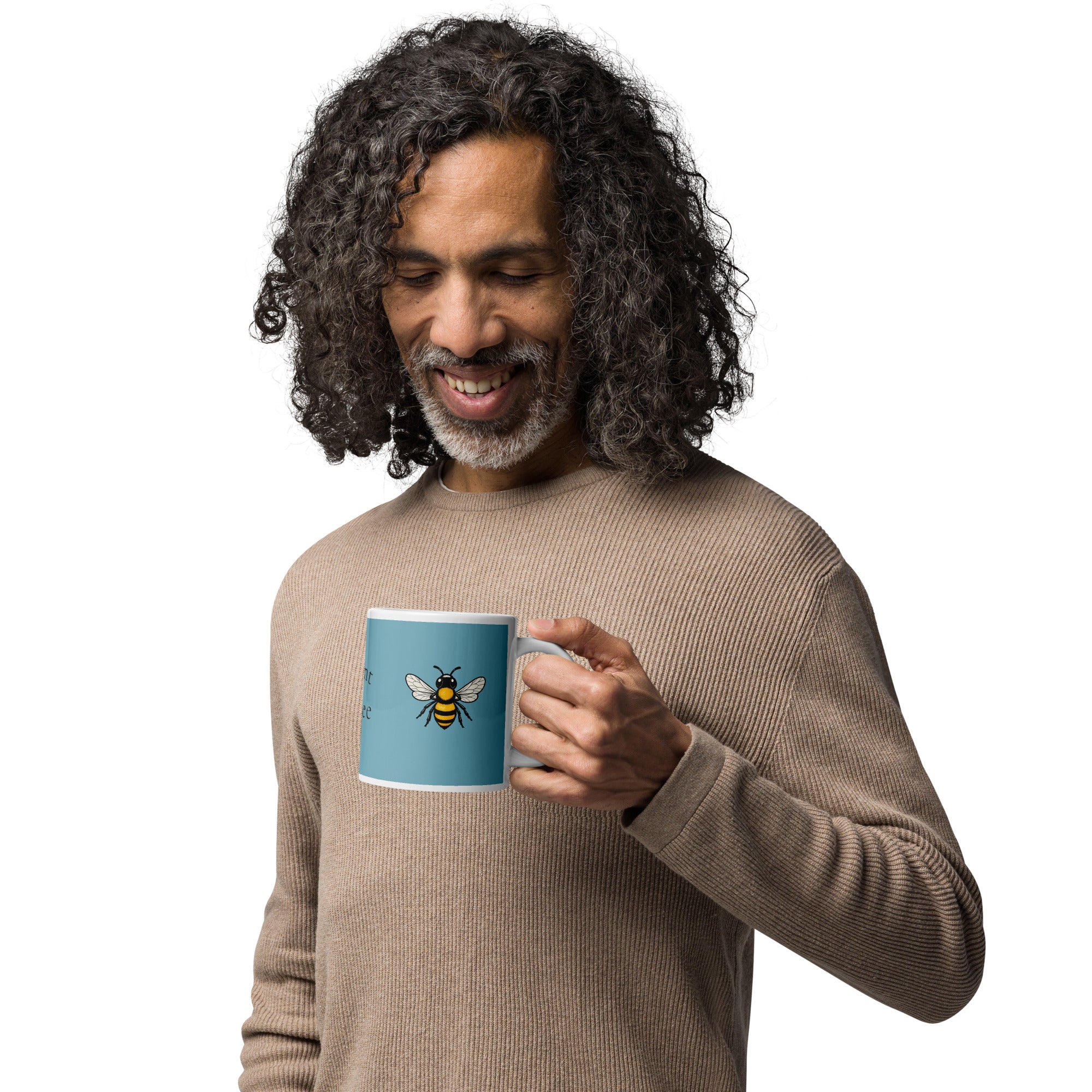 Blue ceramic coffee mug with bee illustration on front panel, white rim and handle