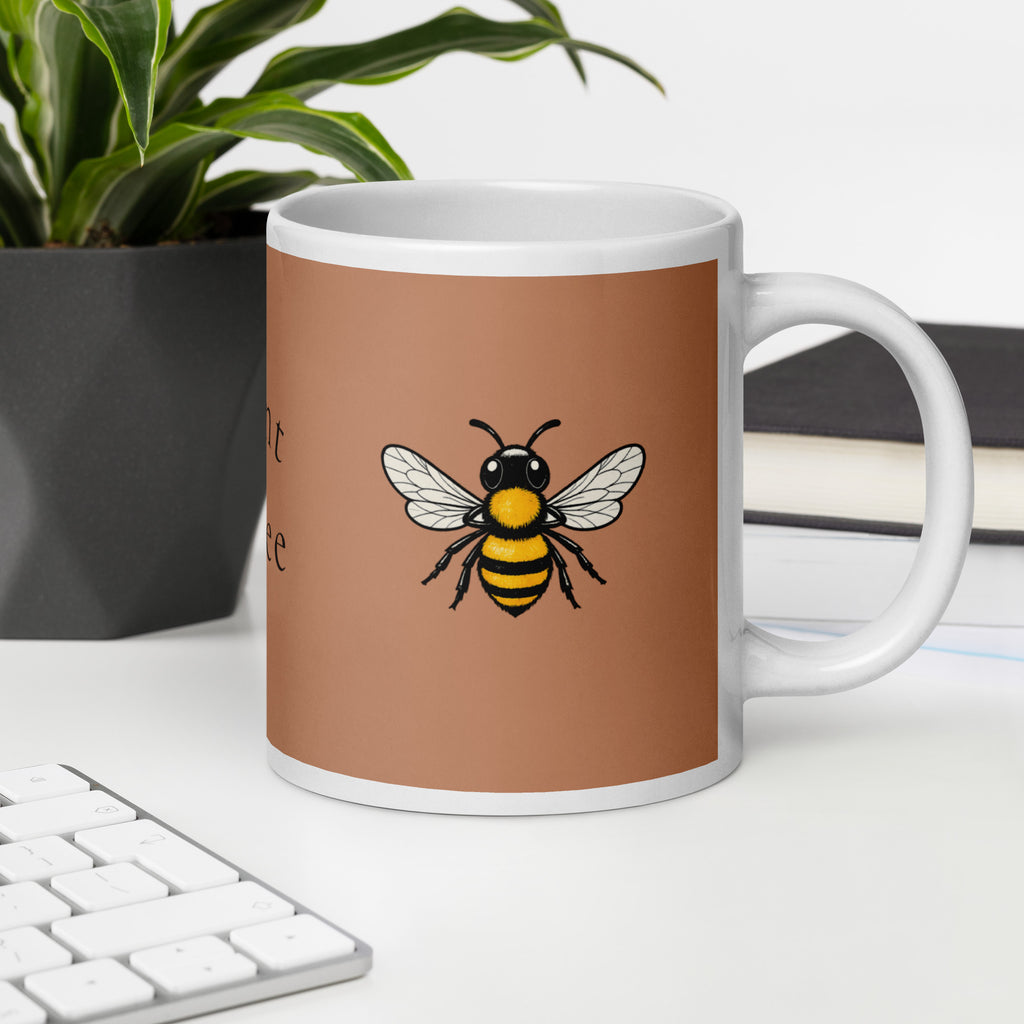 Brown ceramic mug with bee illustration and white handle; angled front view